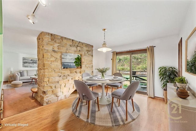 dining space with light hardwood / wood-style flooring