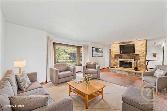 living room with a stone fireplace and light carpet