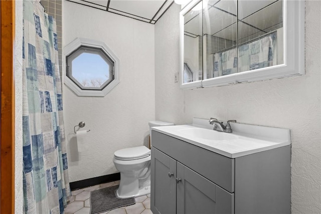 bathroom featuring a shower with curtain, tile patterned floors, vanity, and toilet