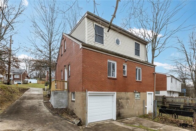 view of property exterior featuring a garage