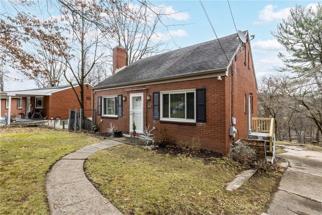 bungalow with a front yard