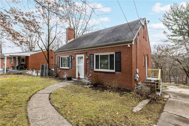 bungalow-style home with a front lawn