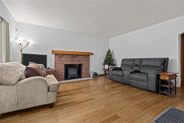 living room featuring a textured ceiling and hardwood / wood-style flooring