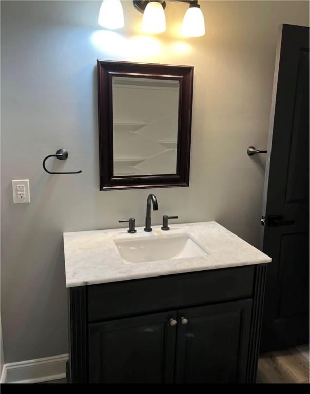 bathroom featuring wood-type flooring and vanity