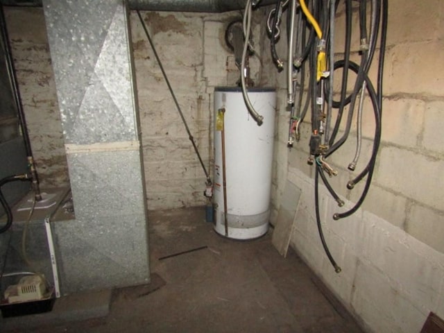 utility room with heating unit and water heater