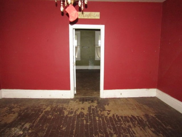 spare room featuring dark hardwood / wood-style floors