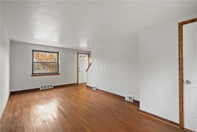 spare room with hardwood / wood-style flooring