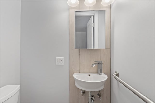 bathroom with toilet and sink