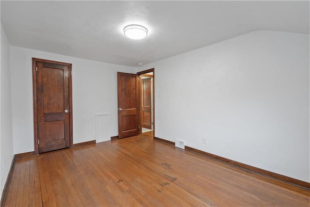 unfurnished room with light hardwood / wood-style flooring