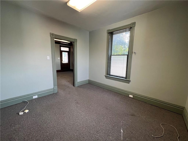 empty room featuring light carpet