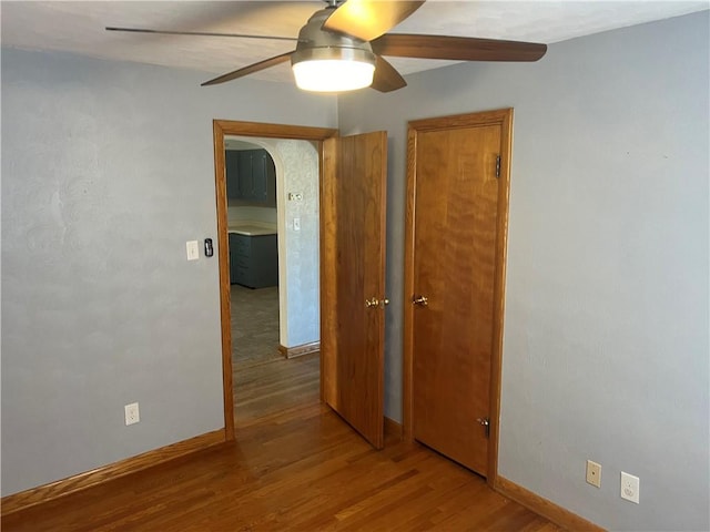 unfurnished room featuring ceiling fan and light hardwood / wood-style flooring