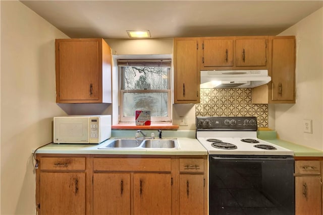 kitchen with white appliances, sink, and tasteful backsplash