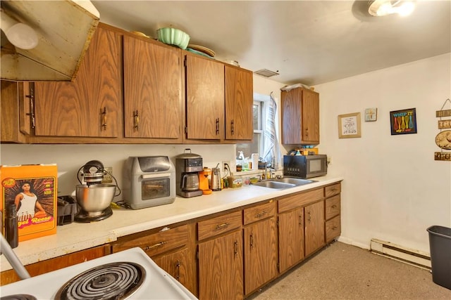 kitchen featuring sink and baseboard heating