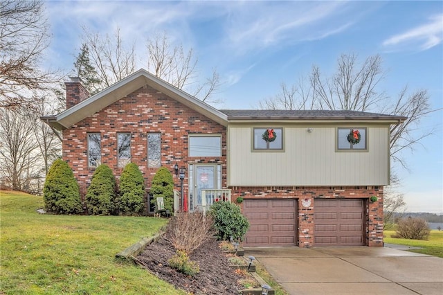 view of front of house featuring a front yard and a garage