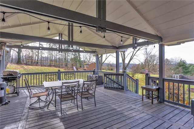 deck featuring a gazebo, a yard, and area for grilling