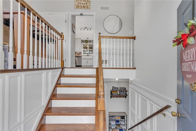 stairway with wood-type flooring