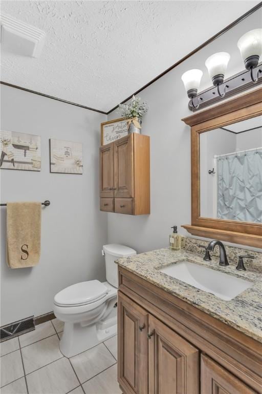 bathroom with curtained shower, tile patterned floors, a textured ceiling, toilet, and vanity