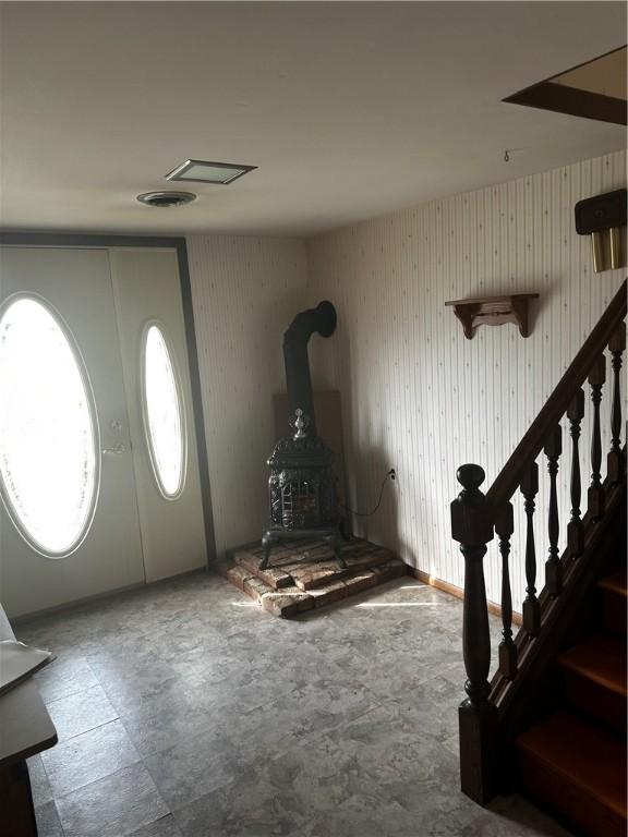 entryway with a wood stove