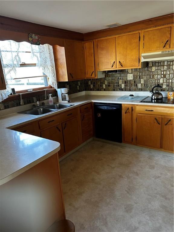 kitchen with sink, tasteful backsplash, and black appliances