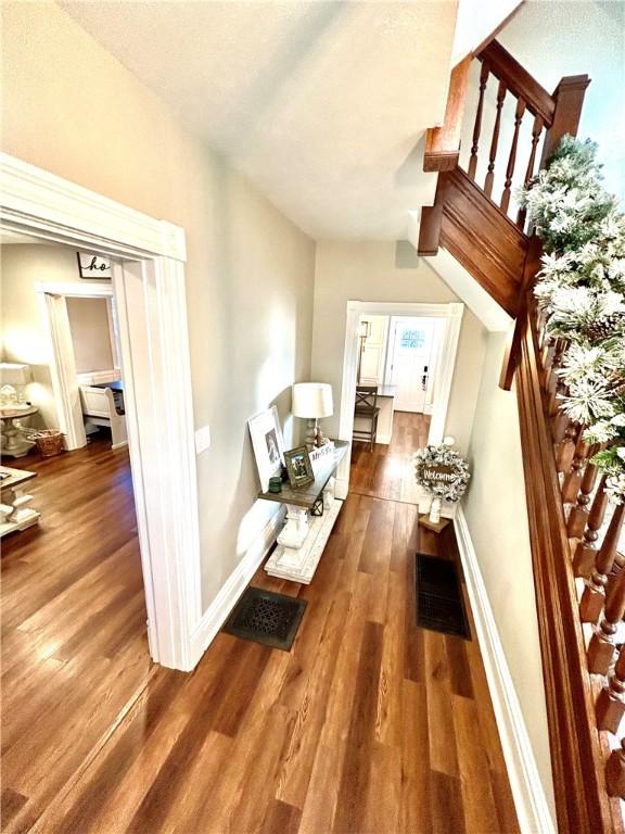 hallway featuring dark hardwood / wood-style flooring