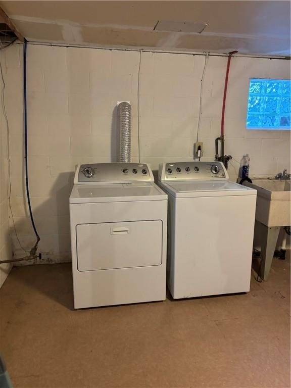 clothes washing area with washing machine and clothes dryer