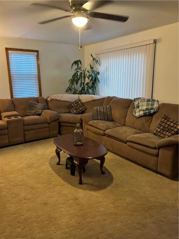 carpeted living room with plenty of natural light and ceiling fan