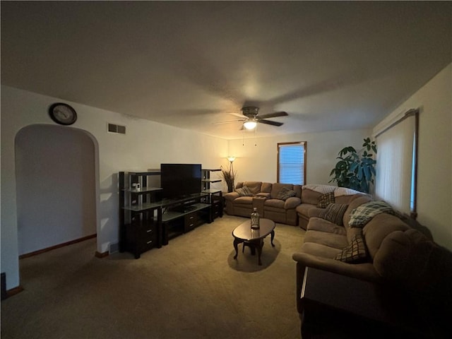 living room with carpet flooring and ceiling fan