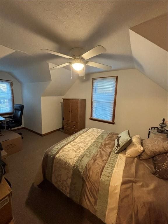 bedroom with a textured ceiling, carpet floors, ceiling fan, and lofted ceiling