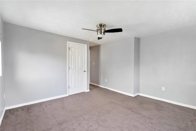 carpeted empty room featuring ceiling fan