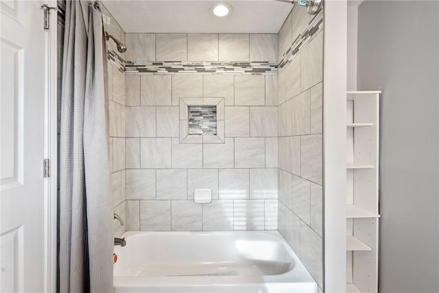 bathroom featuring shower / tub combo with curtain