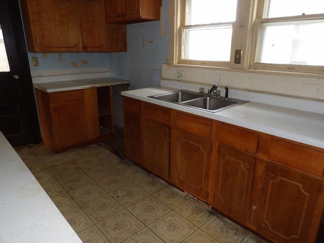 kitchen with sink and tasteful backsplash