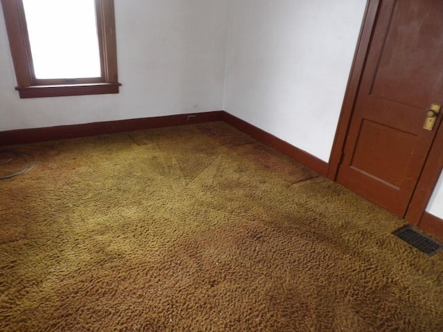 spare room featuring carpet flooring