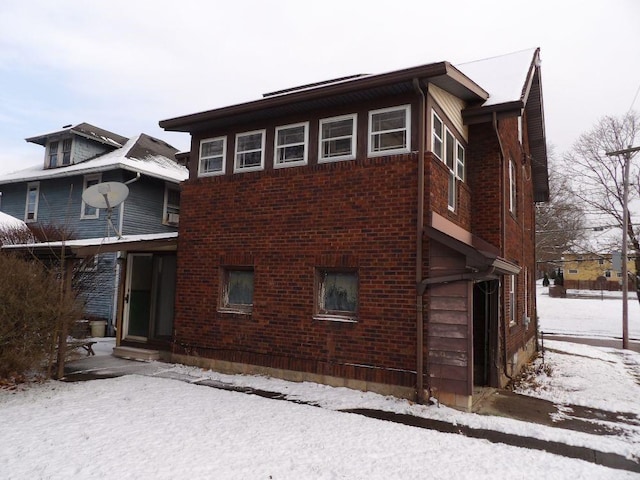 view of snow covered house