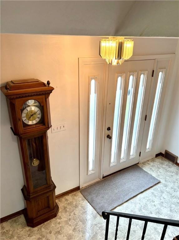 foyer featuring a notable chandelier