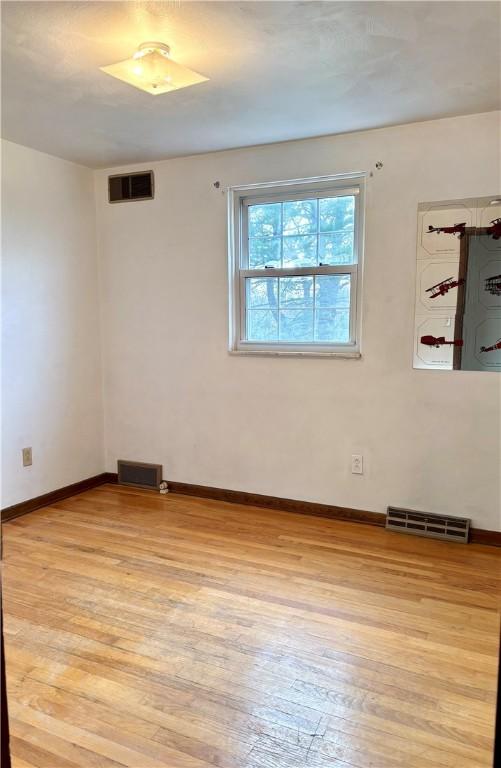 empty room with light wood-type flooring