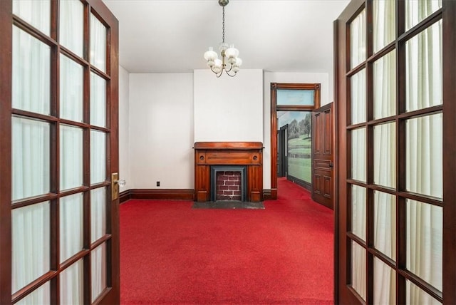 unfurnished office with dark colored carpet and a chandelier