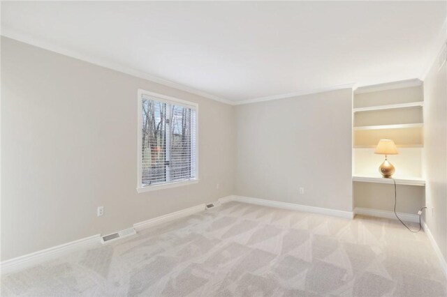 unfurnished room with light carpet and ornamental molding