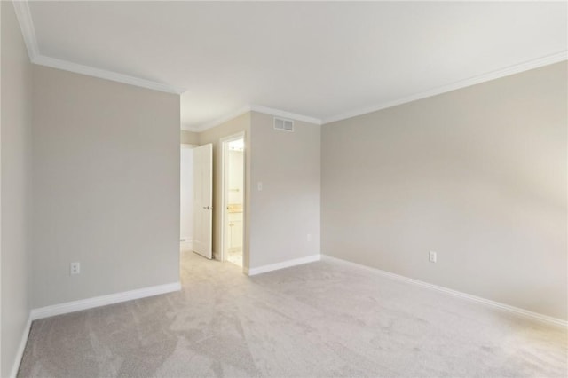 carpeted empty room with ornamental molding