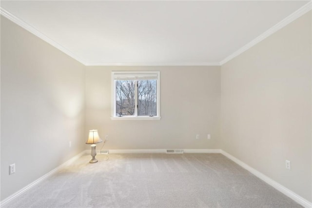 empty room featuring carpet floors and ornamental molding