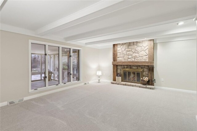 unfurnished living room featuring a fireplace, carpet flooring, and beamed ceiling