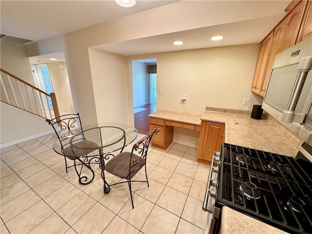 dining space featuring light tile patterned flooring