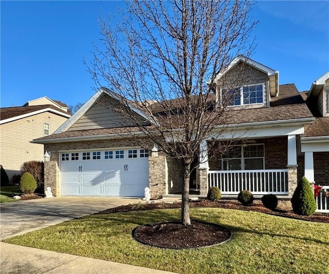 craftsman-style home with a porch, a garage, and a front lawn