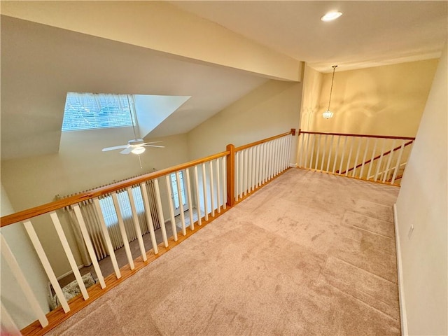 additional living space featuring carpet and ceiling fan