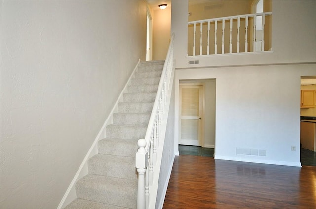 stairway featuring hardwood / wood-style flooring