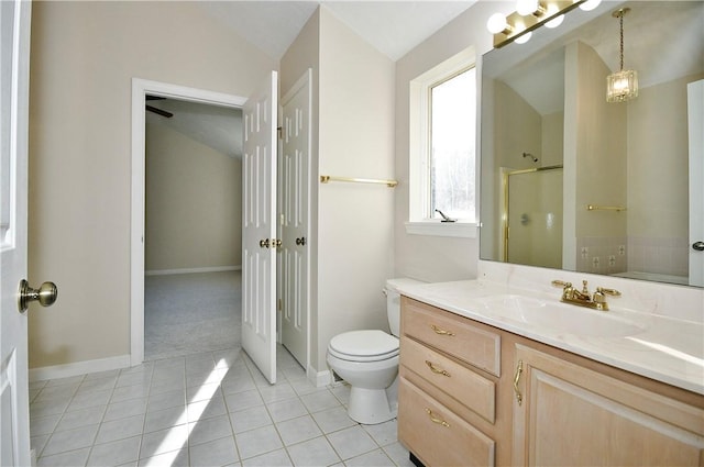 bathroom featuring an enclosed shower, vanity, vaulted ceiling, tile patterned flooring, and toilet