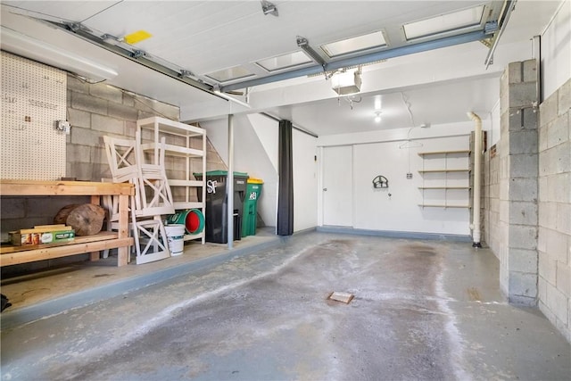 garage featuring a workshop area and a garage door opener