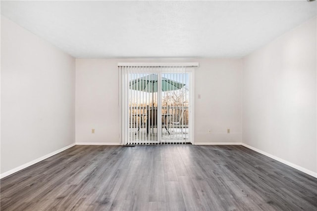 empty room with dark wood-type flooring