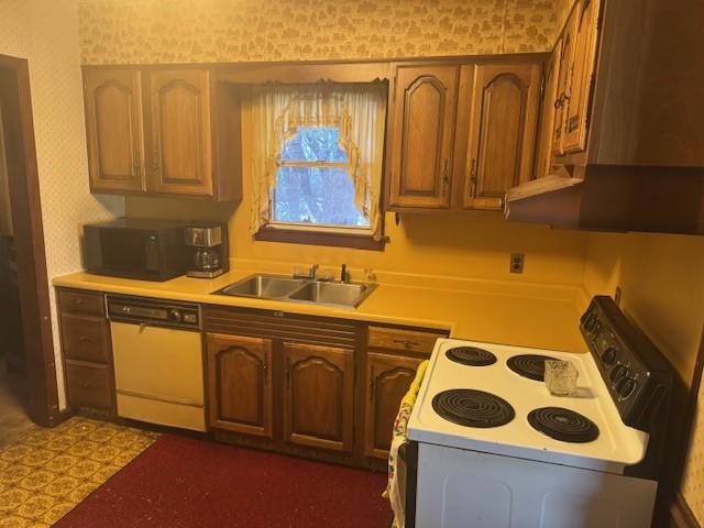 kitchen with white appliances and sink