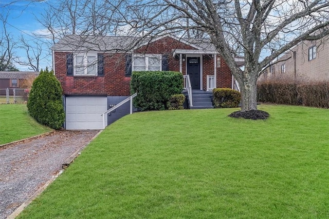 view of front of property featuring a front yard and a garage