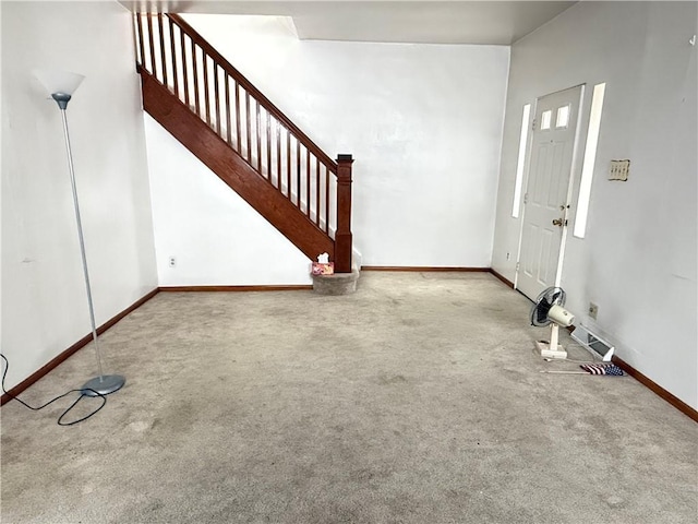 entryway with carpet floors